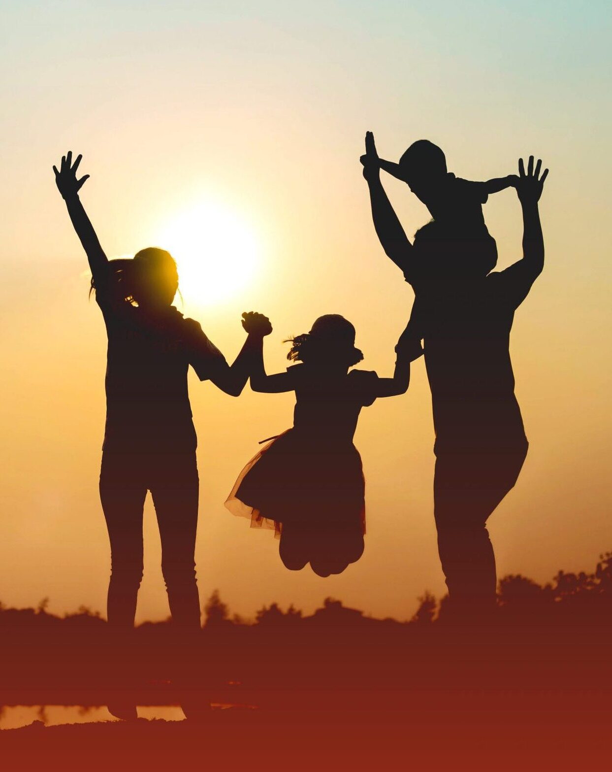 Silhouette of a family comprising a father, mother and two child